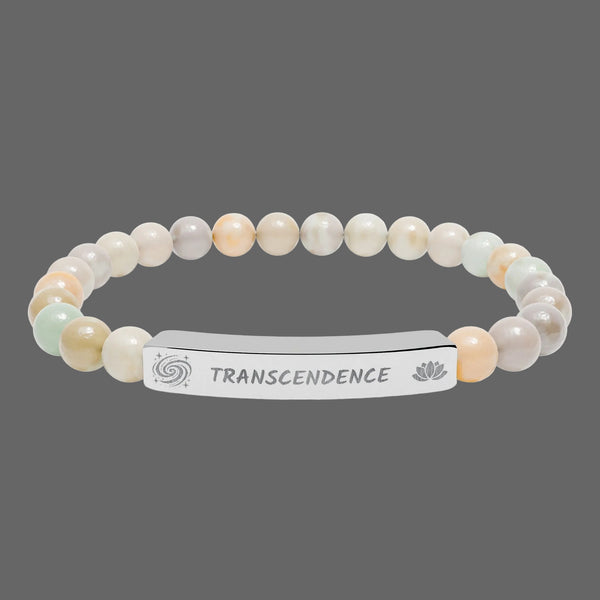 Beaded bracelet with a silver tag saying Transcendence with galaxy and lotus symbols