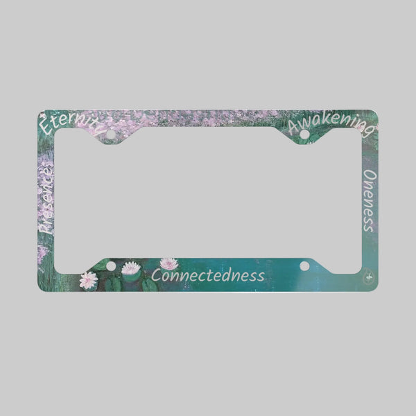 License plate frame with floral design and spiritual terms along the edges