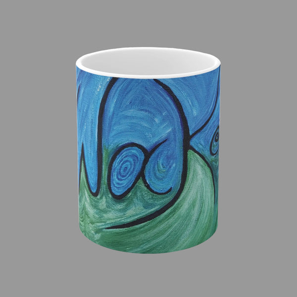 A white ceramic mug featuring an abstract, swirling painted design in shades of blue and green with black Awakening word in script.
