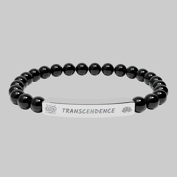 Black beaded bracelet with a silver tag saying Transcendence with galaxy and Lotus symbols