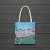 Tote bag with a print of palm tree and sunset painting with lily pads