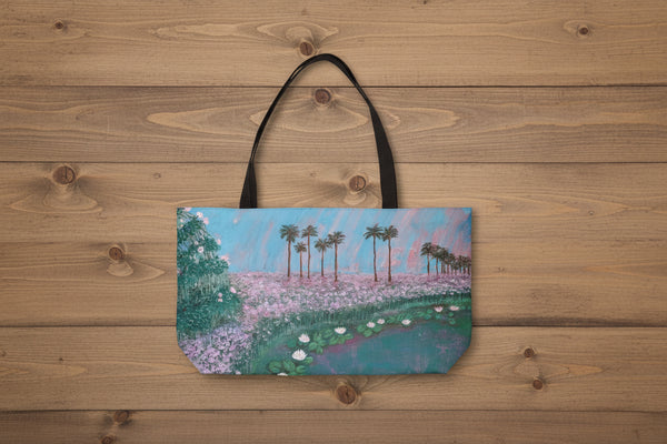Tote bag with a scenic design of palm trees and flowers