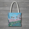 Tote bag with a print of palm tree and sunset painting with lily pads