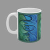 A white ceramic mug featuring an abstract art print with swirling blue and green patterns around the word Awakening written in black cursive script.