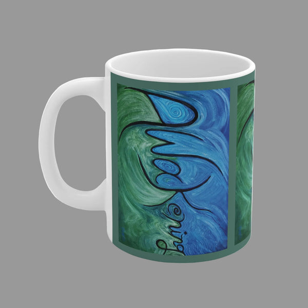 A white ceramic mug featuring an abstract art print with swirling blue and green patterns around the word Awakening written in black cursive script.