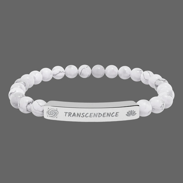 Beaded bracelet with a silver tag saying Transcendence with galaxy and lotus symbols