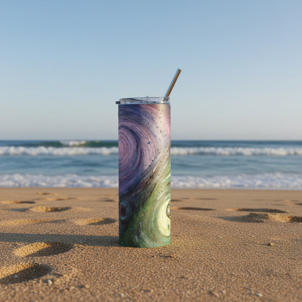 A tall, skinny insulated tumbler with a clear lid and straw, featuring an abstract swirling galaxy and yin yang art print in purple and green tones, .